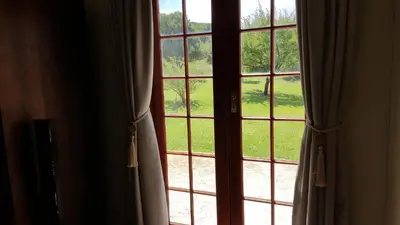 an open window with a view of a yard at Tuckaway in Somerset West