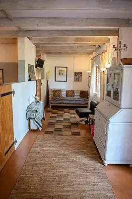 a living room with a couch and a table at Maleki in Windmeul