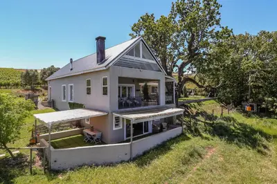 an overhead view of a white house in a field at Wildlife Retreat on a Wine-Farm in Stellenbosch