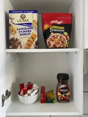 two shelves of a refrigerator filled with food at Azura Sleep Brackenfell in Brackenfell