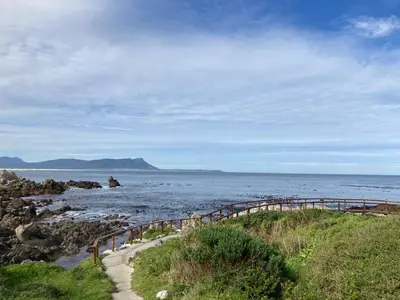 a body of water with a bridge in the water at Beach Cottage in Kleinmond