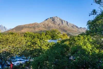 a mountain in the distance with trees and cars at 109 on Dorp in Stellenbosch