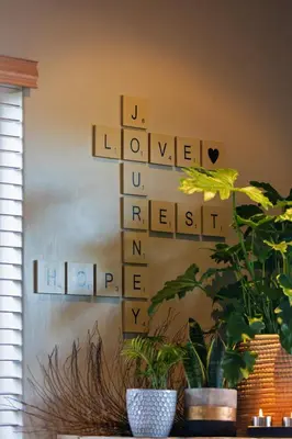 a wall with wooden blocks that spell out the word welcome at Modern Shabby Chic Apartment in Durbanville