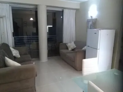 a living room with a couch and a refrigerator at Sunset 786 Holiday Accommodation Unit-207 in Strand