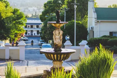 a fountain in the middle of a street at Pontac Manor Hotel & Restaurant in Paarl