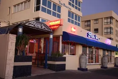 a fast food restaurant on a city street at Beach front property in Strand