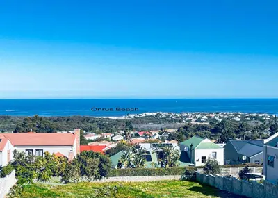 an aerial view of a town with the ocean at Eagleview Guesthouse in Hermanus