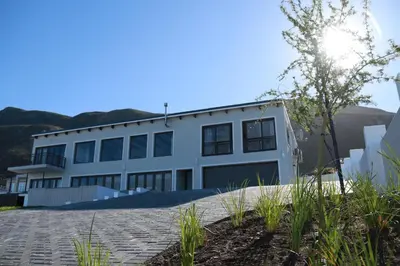 a white building with a lot of windows at Eagleview Guesthouse in Hermanus