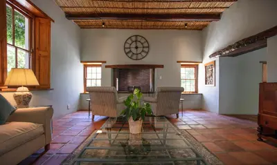 a living room with a couch and a table at Andreas Country House in Wellington