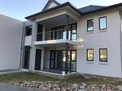 a rendering of a white house at Pearl Valley Suites in Simondium