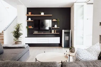 a living room with a couch and a tv at Boschenmeer House in Paarl