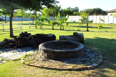 a fire pit in the middle of a park at African Adventures Accommodation in Joostenberg Vlakte