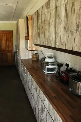 a kitchen with a wooden counter top in a room at African Adventures Accommodation in Joostenberg Vlakte