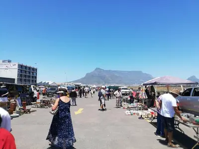 a crowd of people walking around an outdoor market at Milnerton Guesthouse in Cape Town