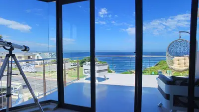 a view of the ocean from the balcony of a house at 7 on Marine in Hermanus