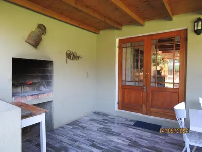 a room with a wooden door and a fireplace at Town and Country in Caledon