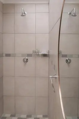 a shower with a glass door in a bathroom at Dolliwarie Guesthouse in Panorama