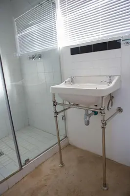 a bathroom with a sink and a shower at Windfall Wine Farm in Robertson
