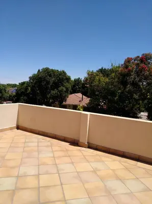 a white fence on top of a roof at Getaway Self-Catering Tyger Valley in Durbanville
