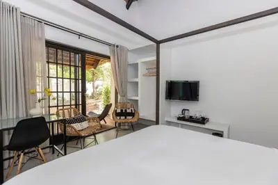 a living room with a table and chairs at Africa Lodge in Somerset West