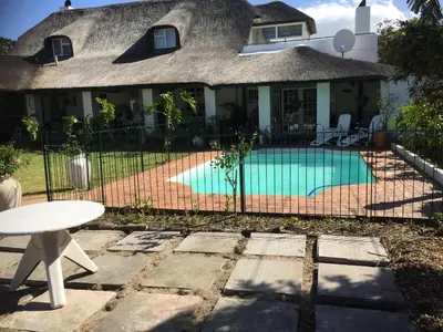 a house with a swimming pool in the yard at Howards End Manor B&B in Cape Town