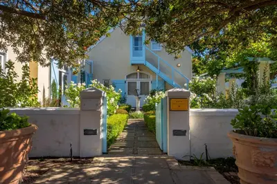 a house with a walkway in front of it at Auberge Clermont in Franschhoek