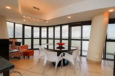 a dining room with a table and chairs at Ocean View 905 Self Catering Accommodation Strand Western Cape South Africa in Strand