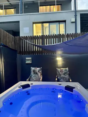 a jacuzzi tub in the middle of a house at 3 Indigo with Solar in Hermanus