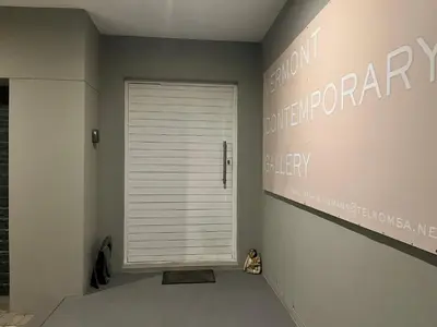 a hallway with a white garage door in a room at 3 Indigo with Solar in Hermanus