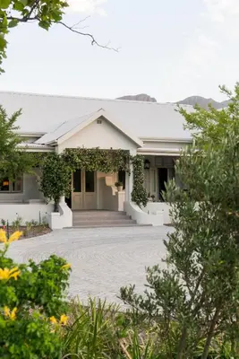 a house with a walkway in front of it at Cape Vue Country House in Franschhoek