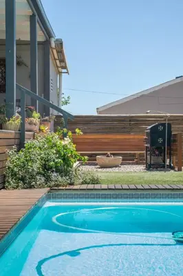 a swimming pool in front of a house at 29 Earlibelle in Stellenbosch