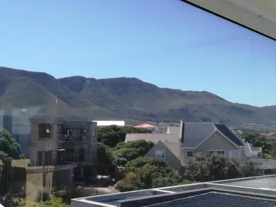 a view from the roof of a house with mountains in the background at Siesta in Hermanus