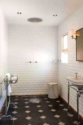 a white bathroom with a sink and a toilet at La Clé Lodge in Franschhoek