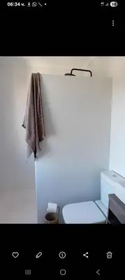 a bathroom with a toilet and a towel at Nagua bay in Gordonʼs Bay