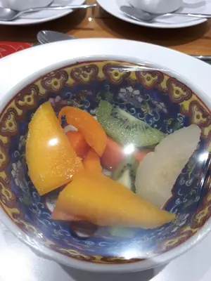 a bowl of fruit and vegetables on a table at Adrian D'Cap Boutique Manor in Stellenbosch
