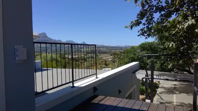 a balcony of a house with a view of the mountains at Little Farm in Raithby