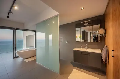 a bathroom with a shower and a sink and a tub at '22 Protea' - Luxury, Style and Elegance - Sleeps 12 in 6 En-suite Bedrooms in Gordonʼs Bay