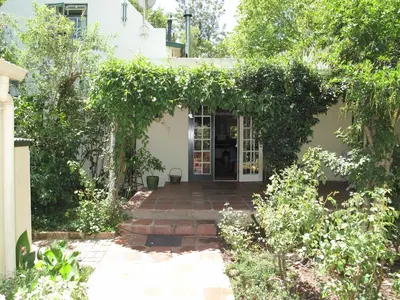 an entrance to a house with an ivy covered doorway at High Hopes in Greyton