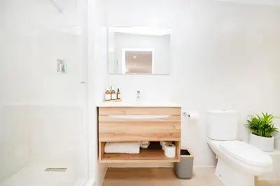a bathroom with a sink and a toilet at 10VDW Self Catering Apartments-Newly Renovated! in Durbanville