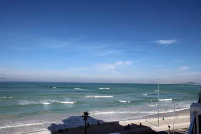 a view of the ocean from a balcony of a beach at Hibernian Towers 505 in Strand