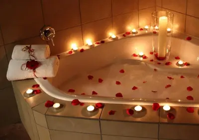 a bath tub with hearts and lights in it at Orange-Ville Lodge & Guesthouse in Stellenbosch