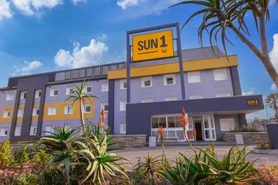 a building with a sign that reads sun at SUN1 MILNERTON in Cape Town