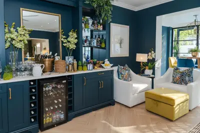 a room with blue walls and a wine cellar at Last Word Franschhoek in Franschhoek
