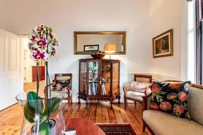 a living room with a couch and a table at Carmichael House Boutique Hotel in Cape Town