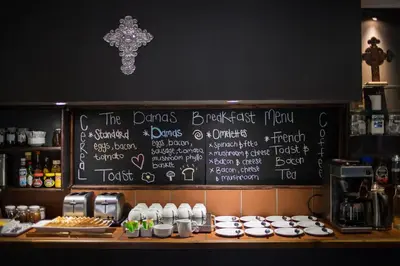 a chalkboard with a menu on the wall of a restaurant at Damas Guest Farm in Worcester