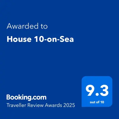 a blue text box with the words awarded to house on sea at House 10-on-Sea in Hermanus
