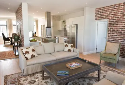 a living room with a couch and a table at 14 On Louw in Stellenbosch