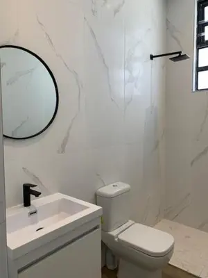 a bathroom with a sink and a toilet and a mirror at Anna Beulah Farm in Durbanville