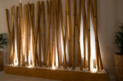 a row of wooden pipes in a wall at Bamboo Guest House in Hermanus