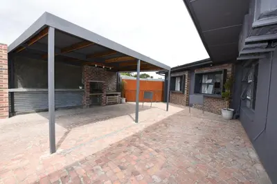 a pavilion with a brick patio in a building at OnQ Accommodation in Bellville